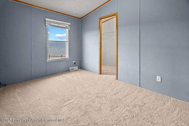 a view of room with window and hardwood floor