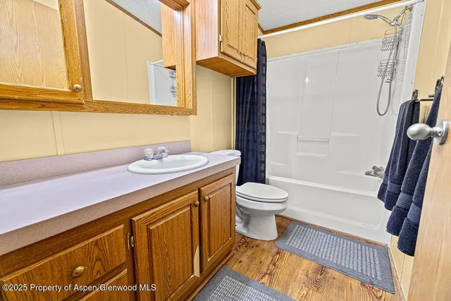 a spacious bathroom with a sink and a mirror