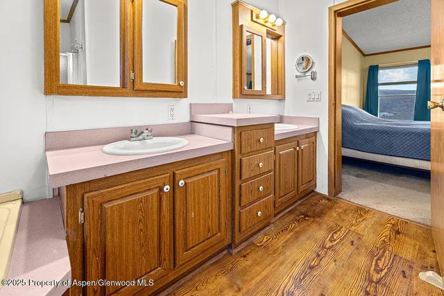 a small white tub sitting next to a window