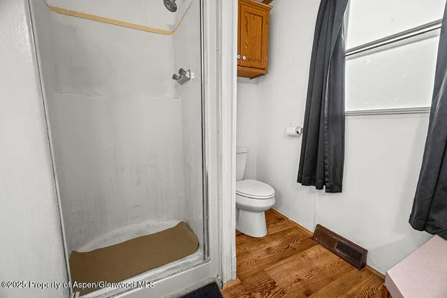 a spacious bathroom with a granite countertop sink and a large mirror