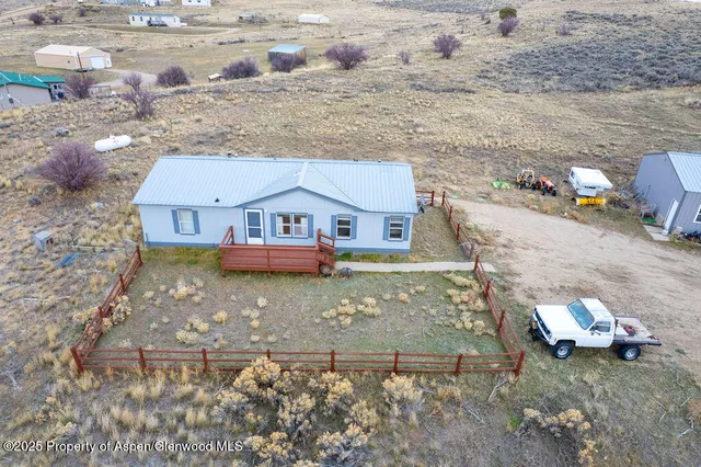 a view of house with a yard