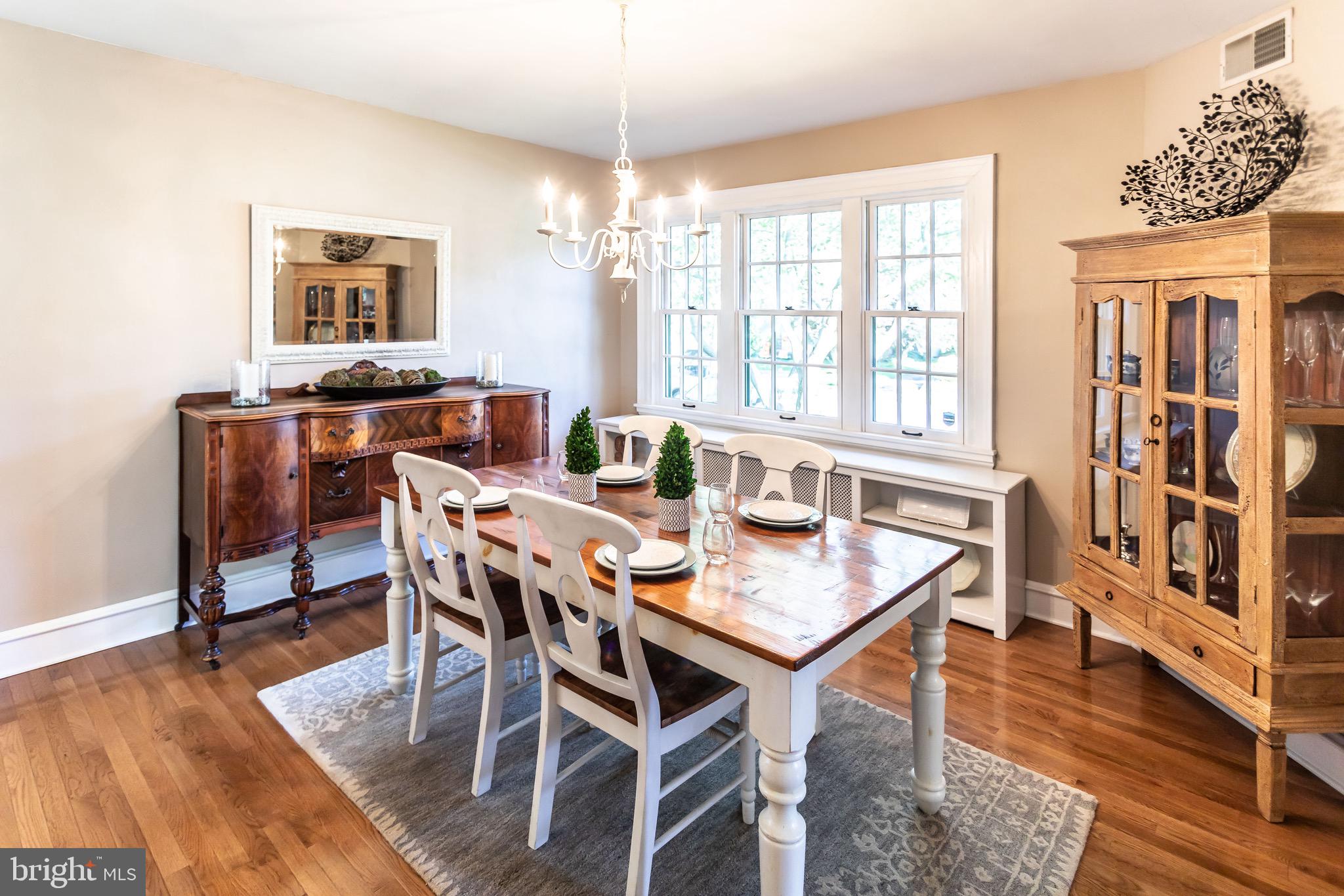 105 West Clearfield Road Havertown, PA 19083 - Photo 16 of 56 a view of a dining room with furniture window and wooden floor