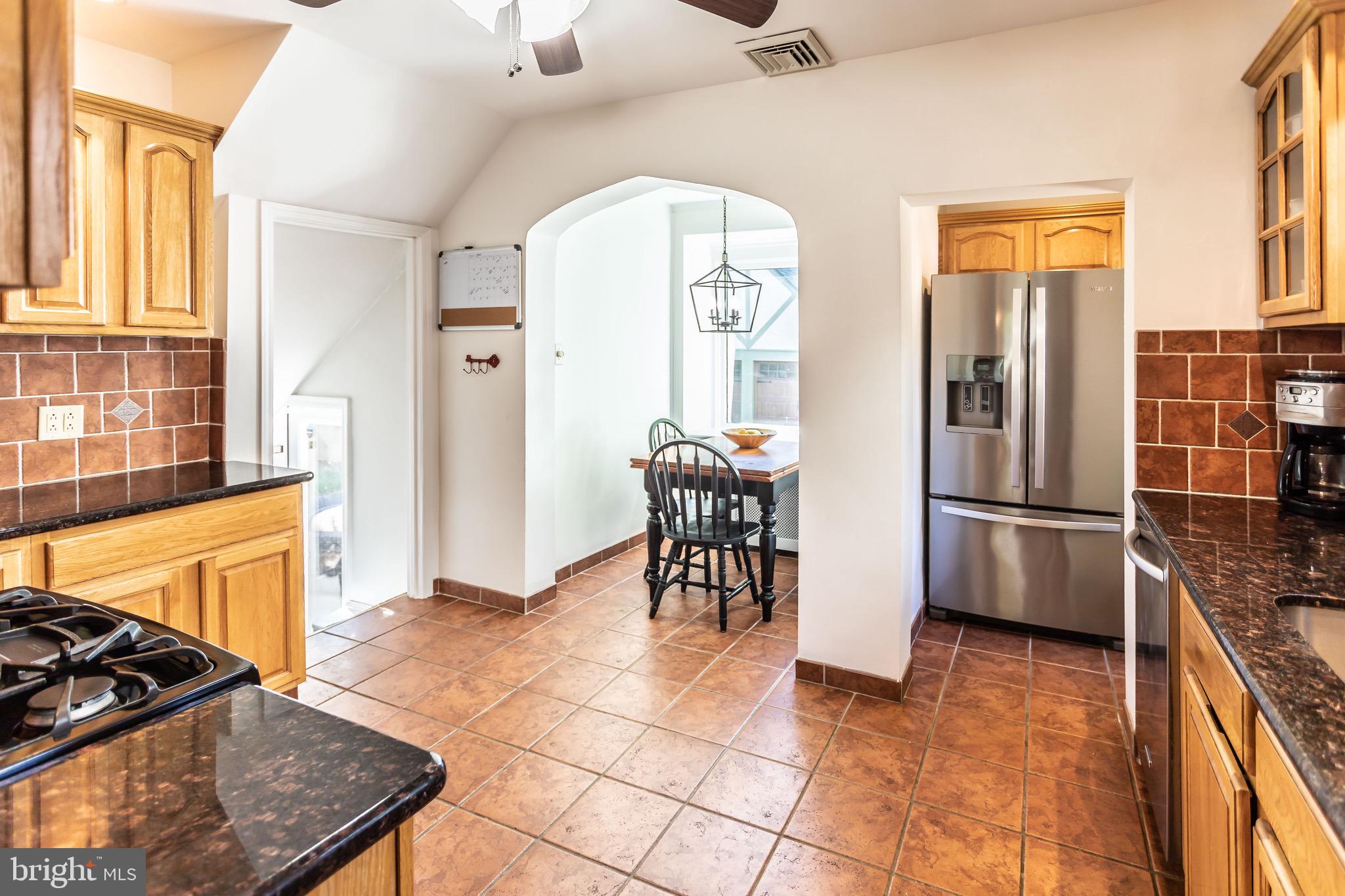 105 West Clearfield Road Havertown, PA 19083 - Photo 20 of 56 a kitchen with stainless steel appliances granite countertop a refrigerator and a stove top oven