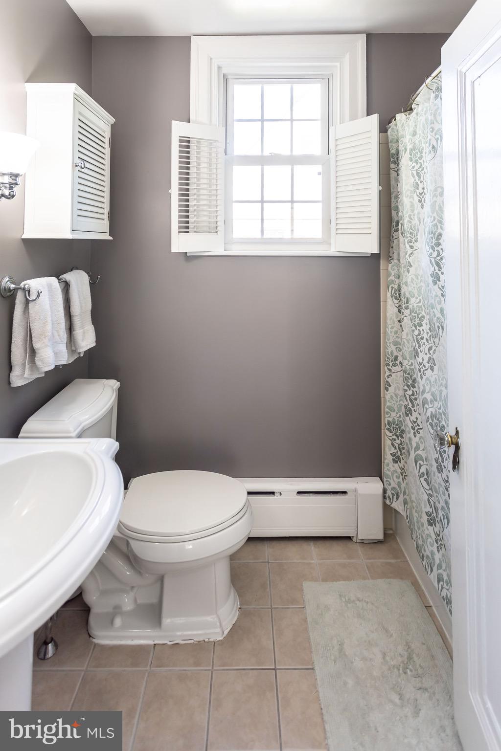 105 West Clearfield Road Havertown, PA 19083 - Photo 27 of 56 a white toilet sitting next to a window
