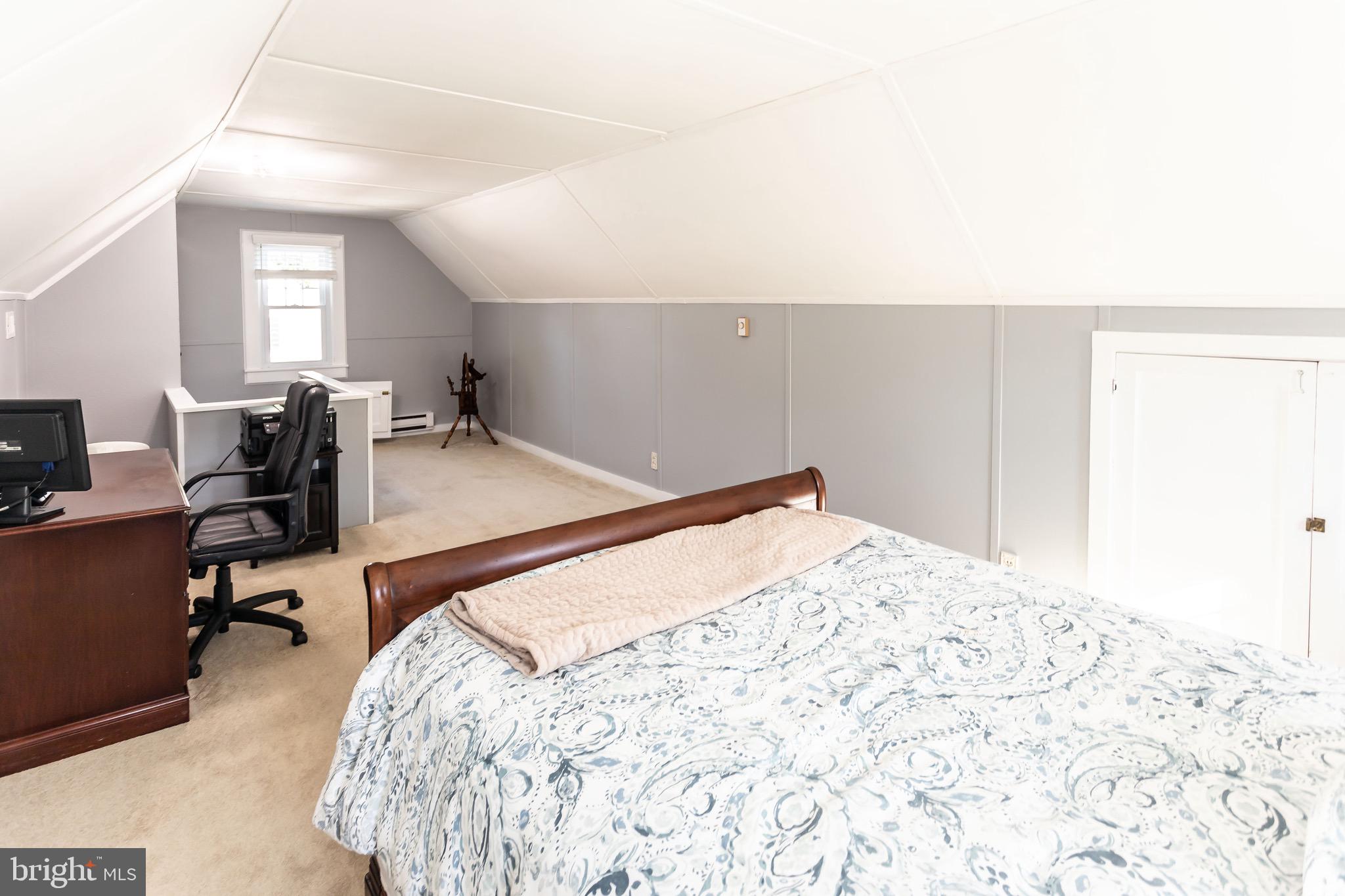 105 West Clearfield Road Havertown, PA 19083 - Photo 37 of 56 a bedroom with a bed and a chair