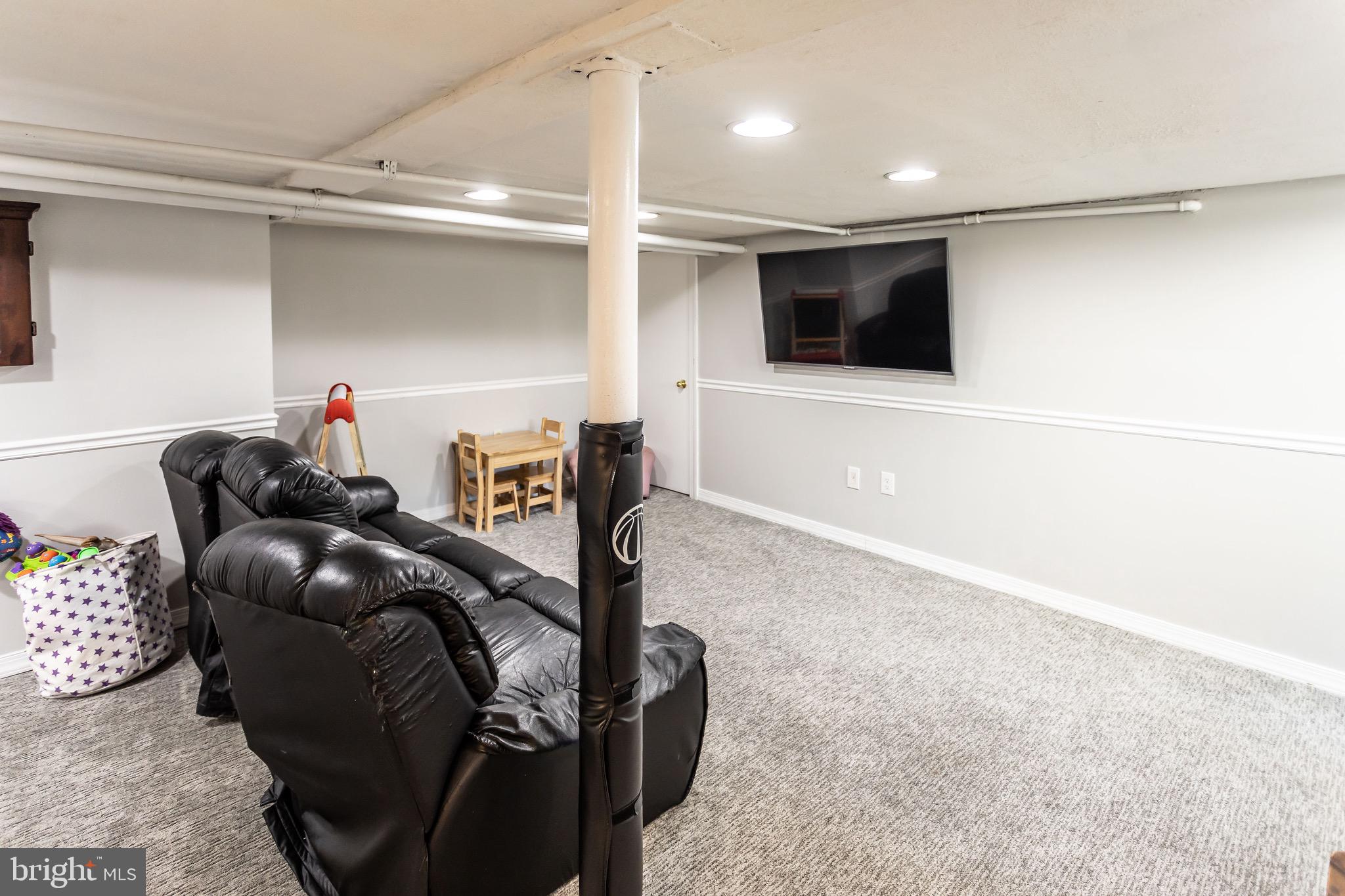 105 West Clearfield Road Havertown, PA 19083 - Photo 41 of 56 a living room with furniture and a flat screen tv