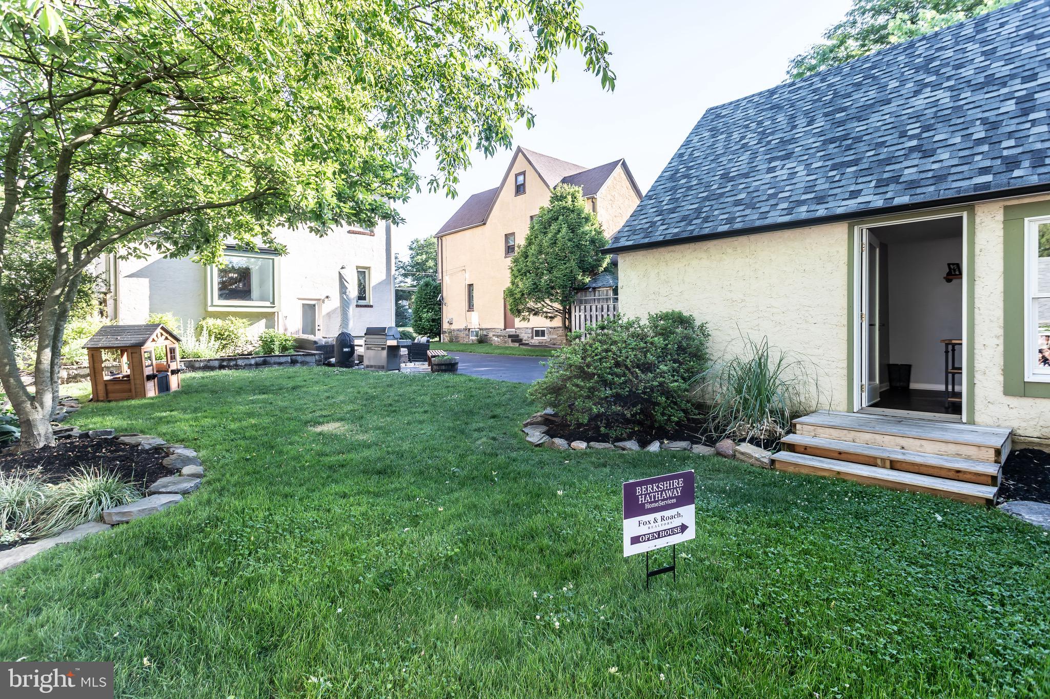 105 West Clearfield Road Havertown, PA 19083 - Photo 50 of 56 a front view of a house with a garden