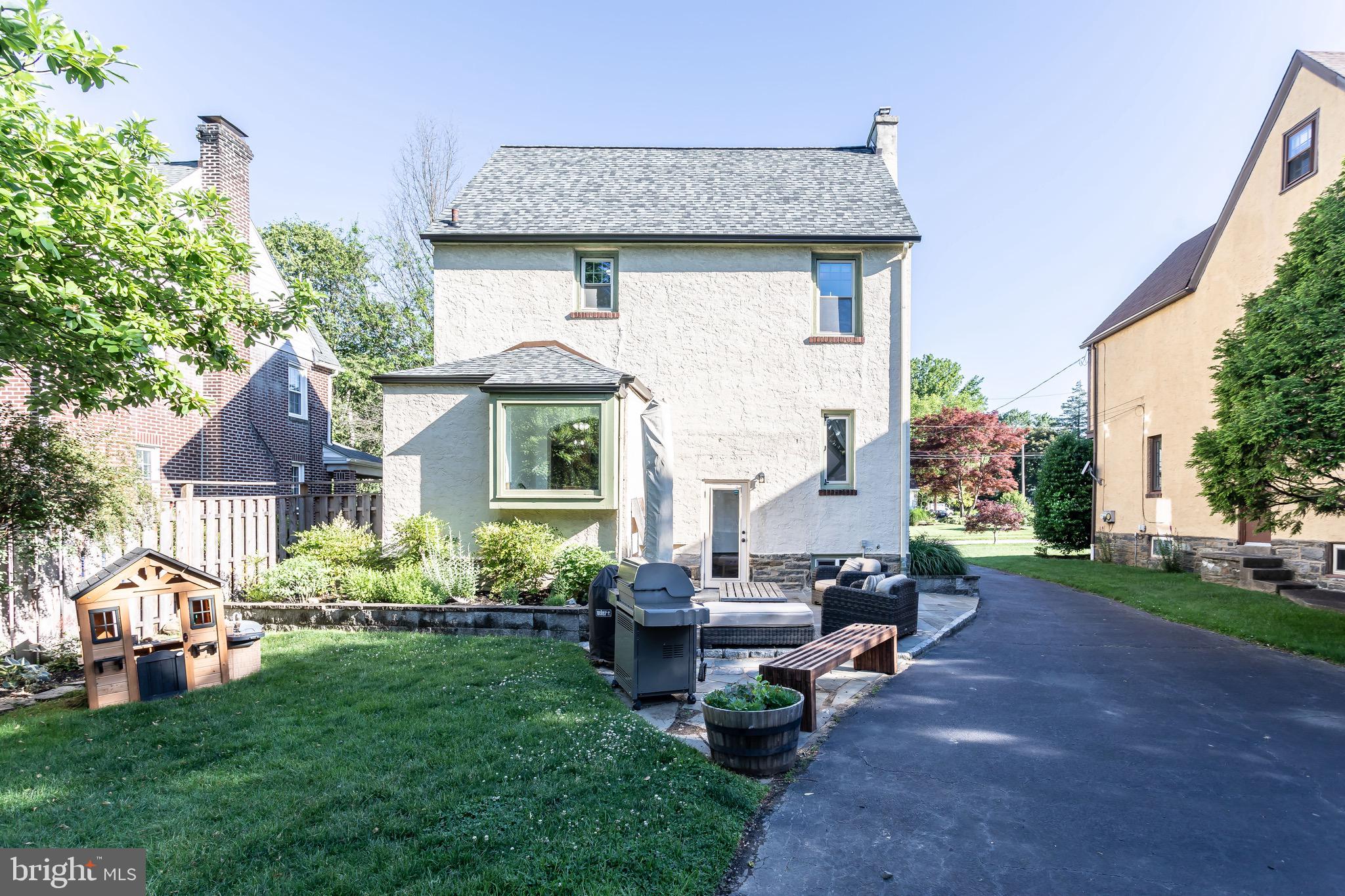 105 West Clearfield Road Havertown, PA 19083 - Photo 53 of 56 a front view of a house with garden and sitting area