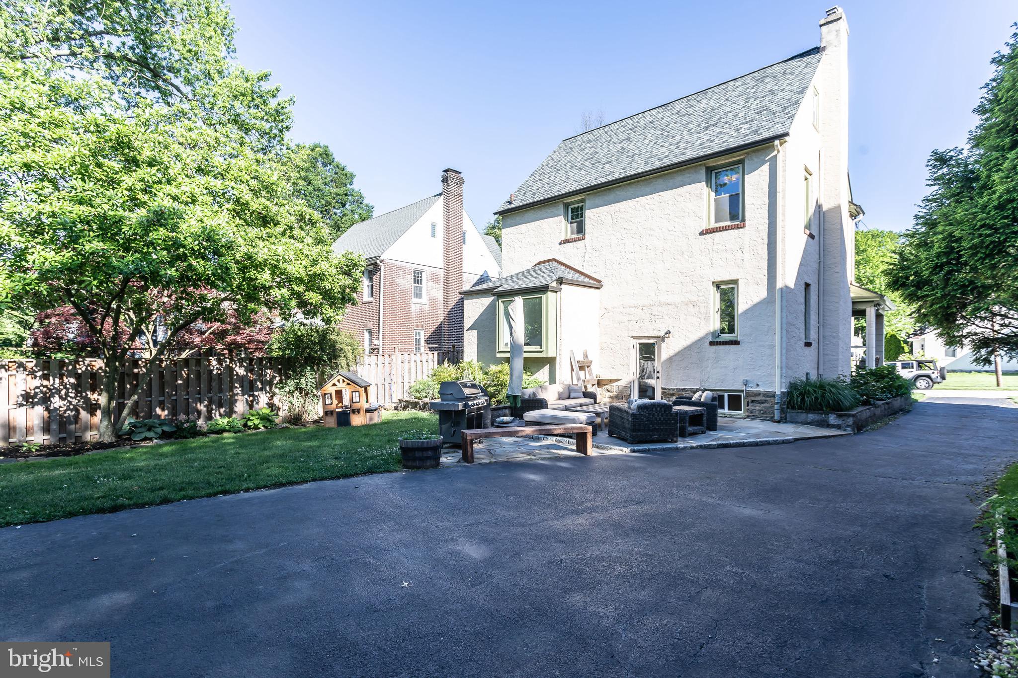 105 West Clearfield Road Havertown, PA 19083 - Photo 54 of 56 a view of a patio with table and chairs and potted plants