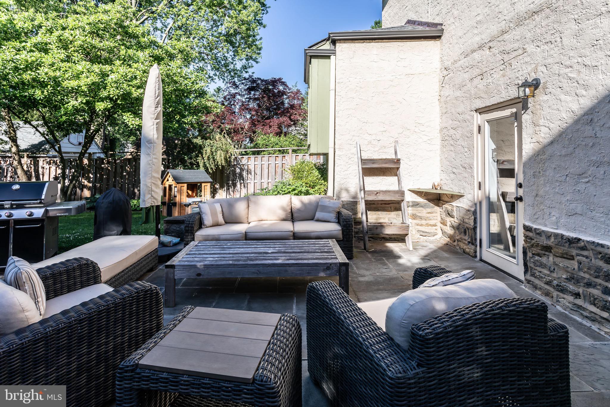 105 West Clearfield Road Havertown, PA 19083 - Photo 55 of 56 a outdoor living space with patio furniture and a fireplace