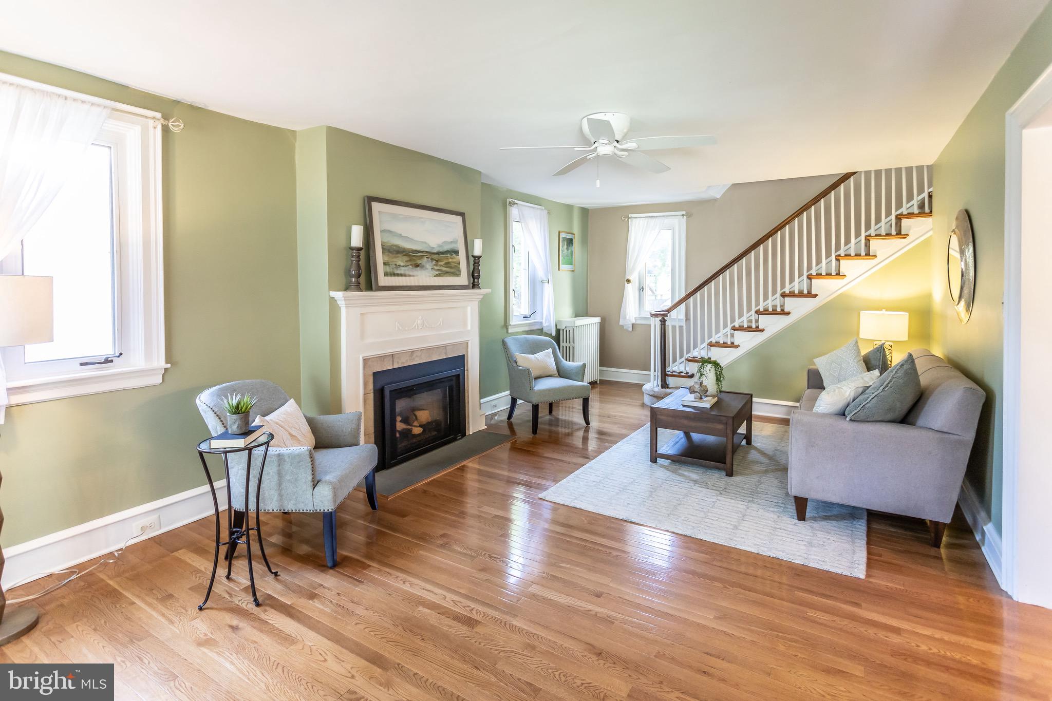 105 West Clearfield Road Havertown, PA 19083 - Photo 7 of 56 a living room with furniture and a fireplace