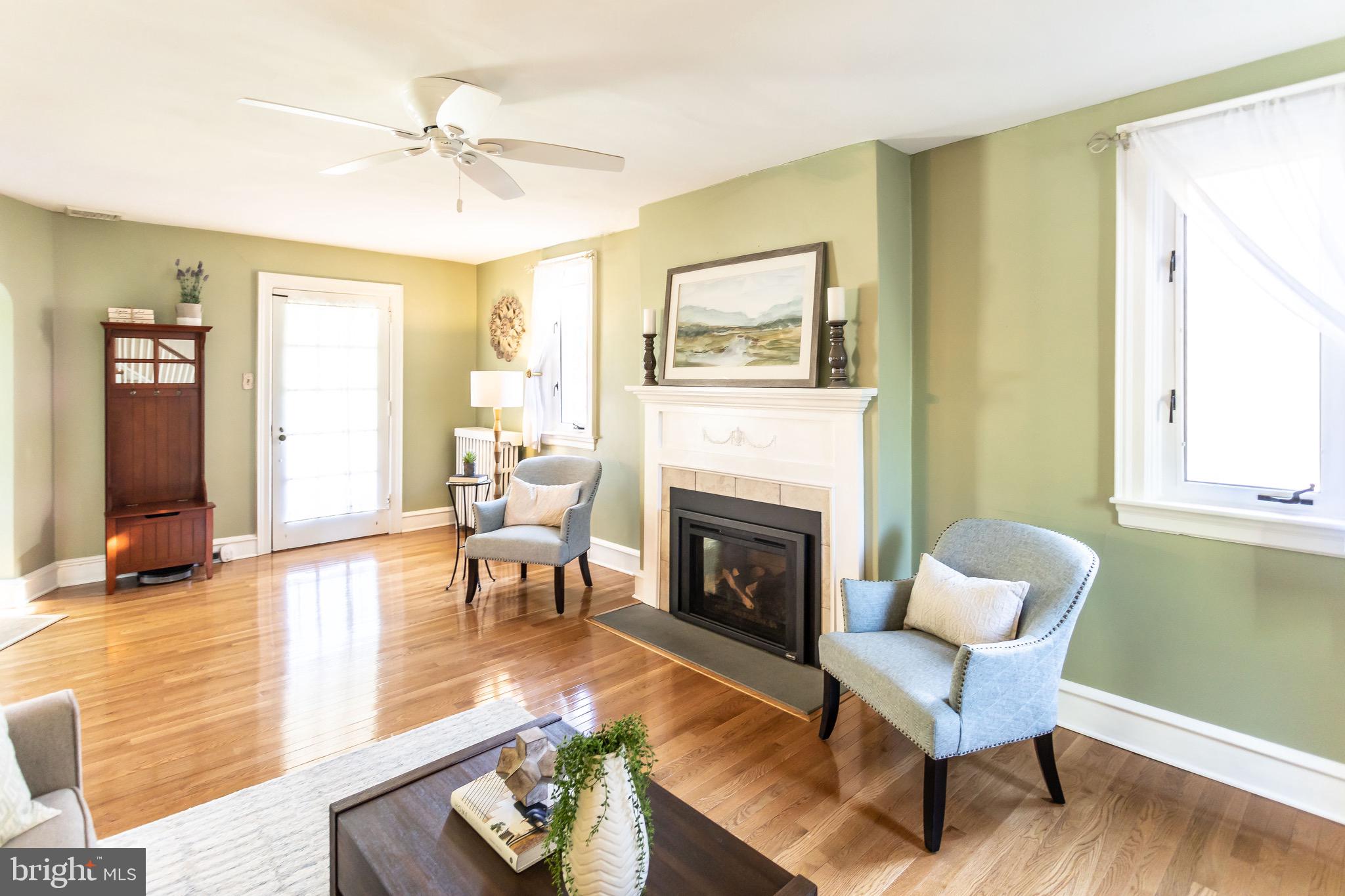 105 West Clearfield Road Havertown, PA 19083 - Photo 10 of 56 a living room with furniture and a fireplace