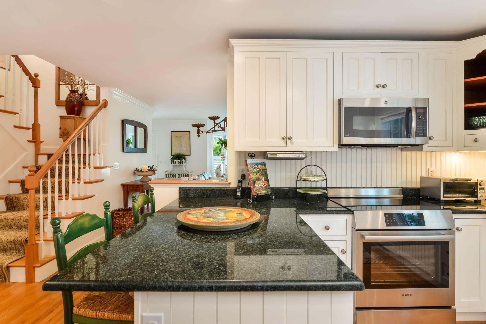 195 Cotuit Road, Unit 8 Marstons Mills, MA 02648 - Photo 11 of 46 a kitchen with a stove a sink and a microwave