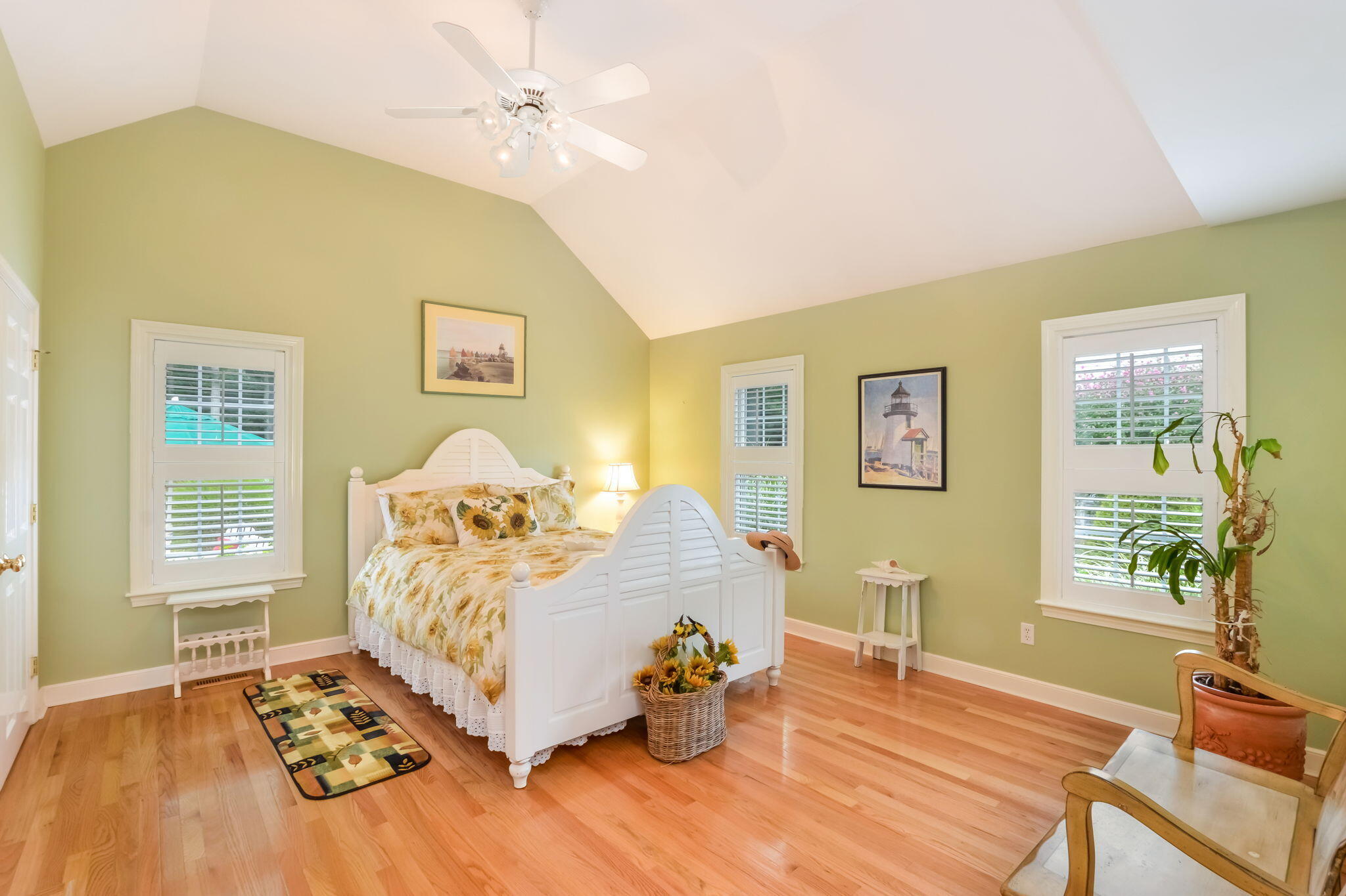 195 Cotuit Road, Unit 8 Marstons Mills, MA 02648 - Photo 18 of 46 a bedroom with a bed and wooden floor