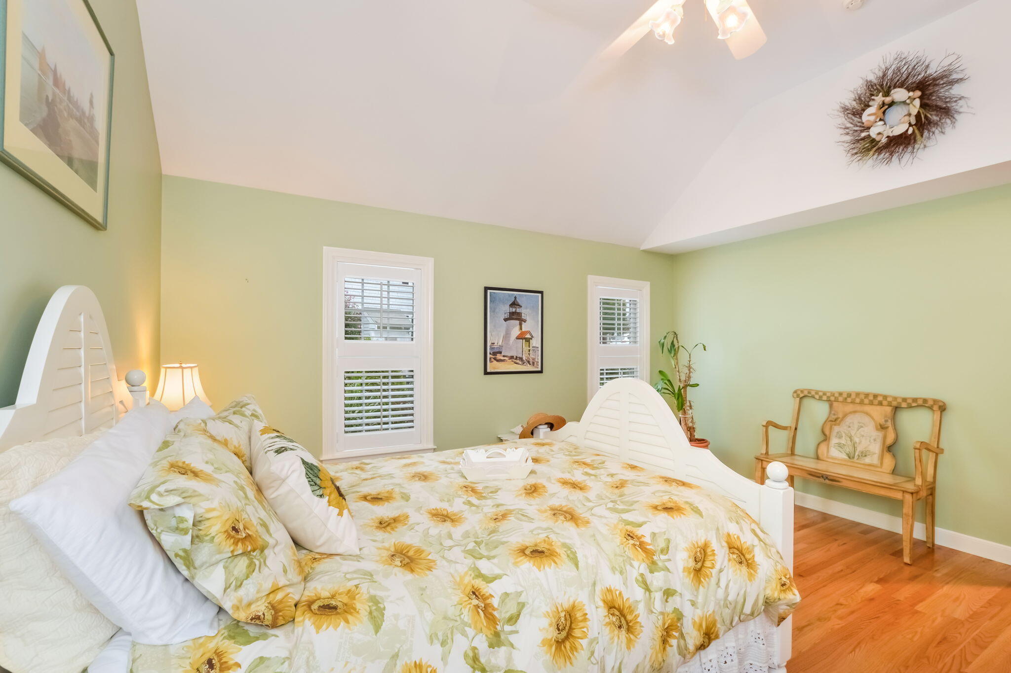 195 Cotuit Road, Unit 8 Marstons Mills, MA 02648 - Photo 19 of 46 a bedroom with a bed and a chair