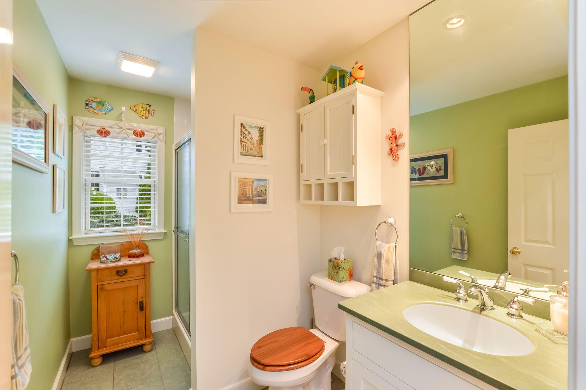 195 Cotuit Road, Unit 8 Marstons Mills, MA 02648 - Photo 21 of 46 a bathroom with a sink toilet and a mirror