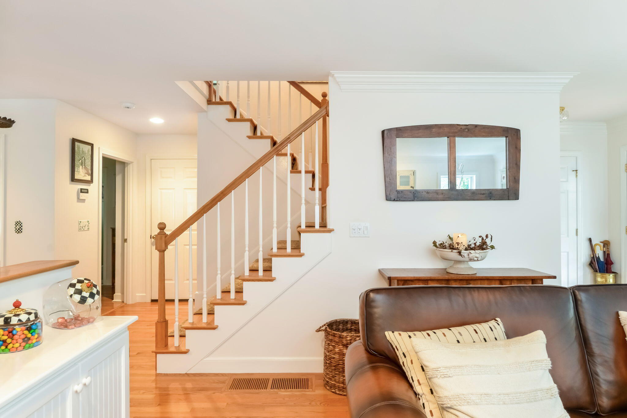 195 Cotuit Road, Unit 8 Marstons Mills, MA 02648 - Photo 22 of 46 a living room with furniture and stairs