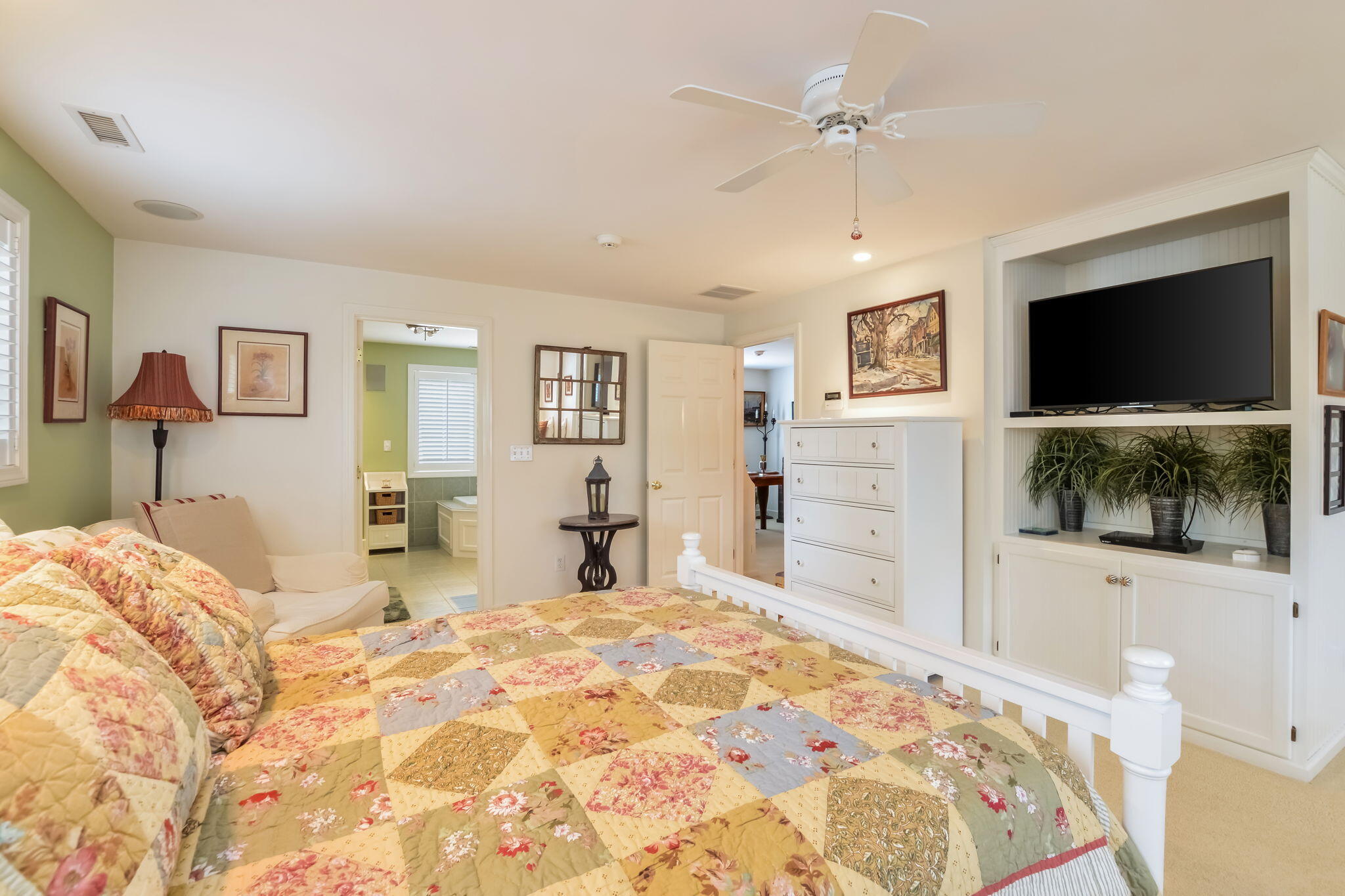 195 Cotuit Road, Unit 8 Marstons Mills, MA 02648 - Photo 26 of 46 a bedroom with a bed and a flat screen tv