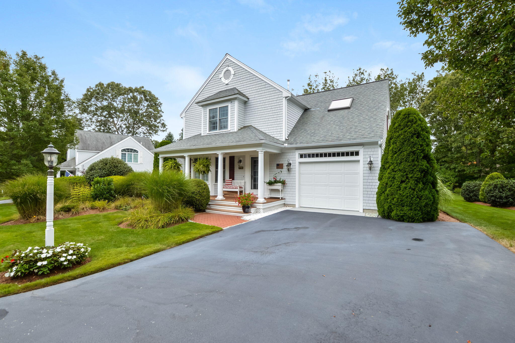 195 Cotuit Road, Unit 8 Marstons Mills, MA 02648 - Photo 3 of 46 a front view of a house with garden