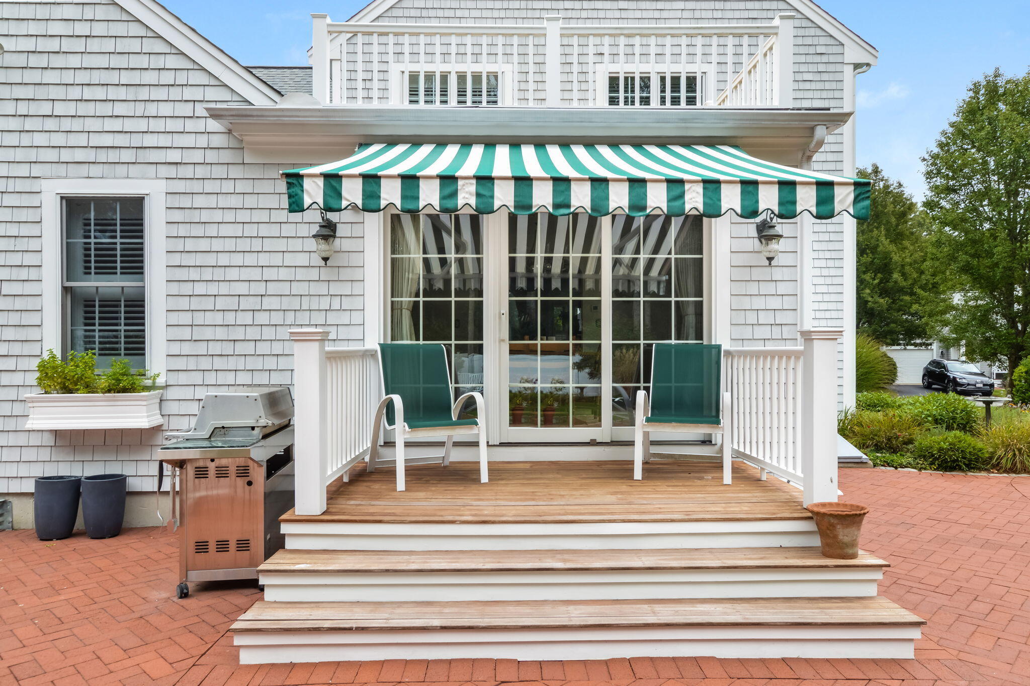 195 Cotuit Road, Unit 8 Marstons Mills, MA 02648 - Photo 38 of 46 a view of a building with a porch