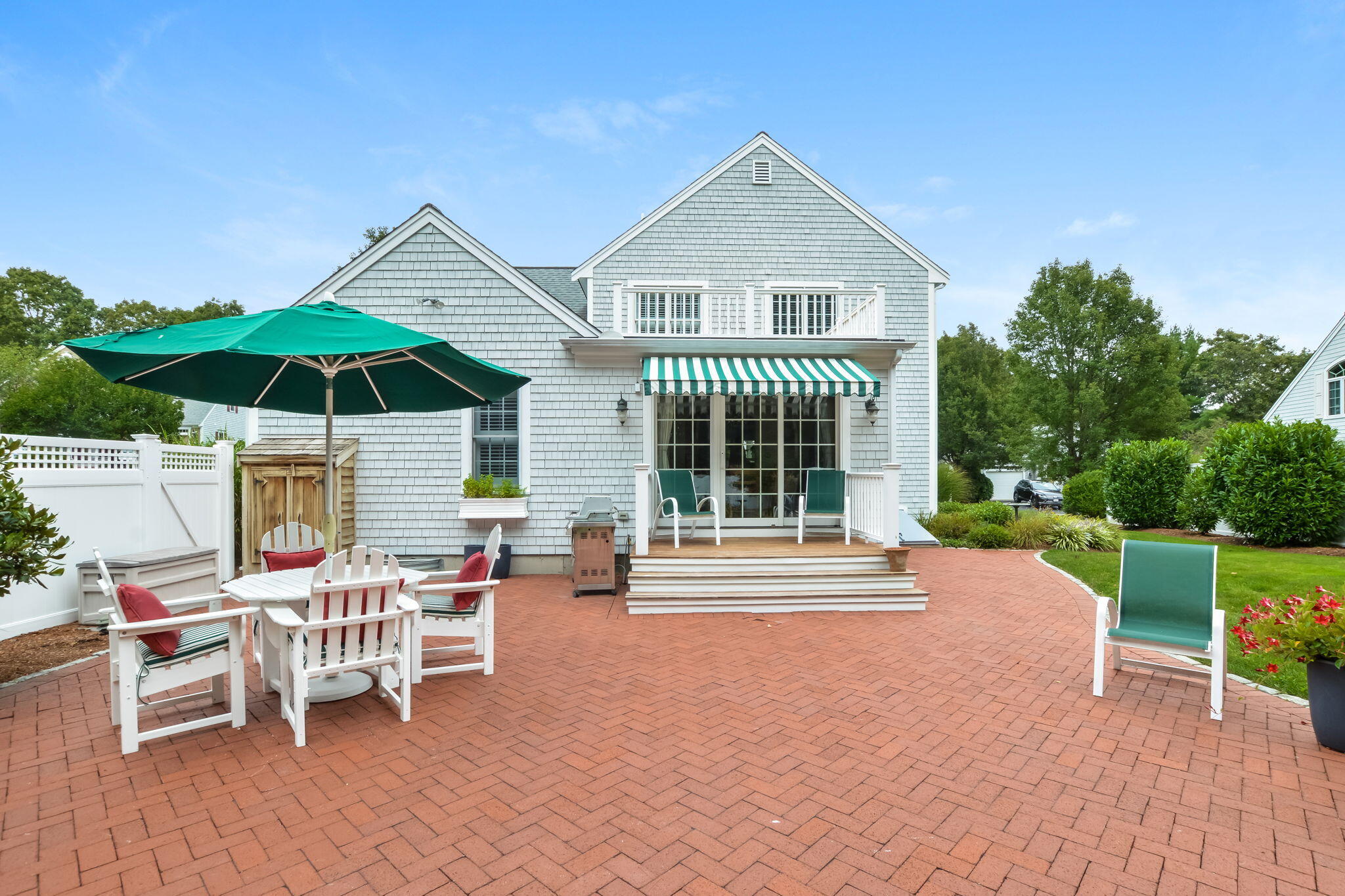 195 Cotuit Road, Unit 8 Marstons Mills, MA 02648 - Photo 41 of 46 a view of a house with backyard porch and sitting area