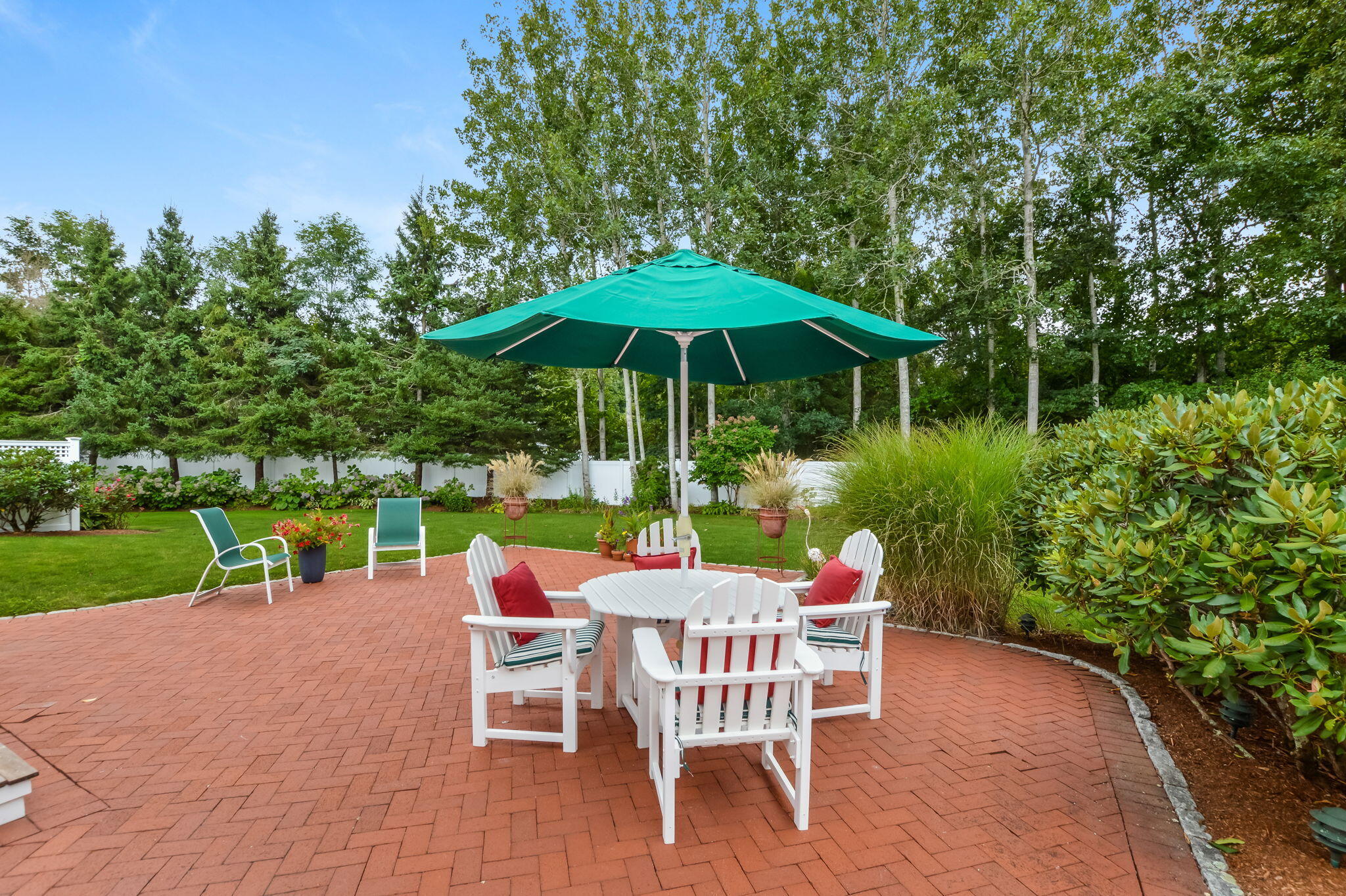 195 Cotuit Road, Unit 8 Marstons Mills, MA 02648 - Photo 42 of 46 a patio with garden area and patio