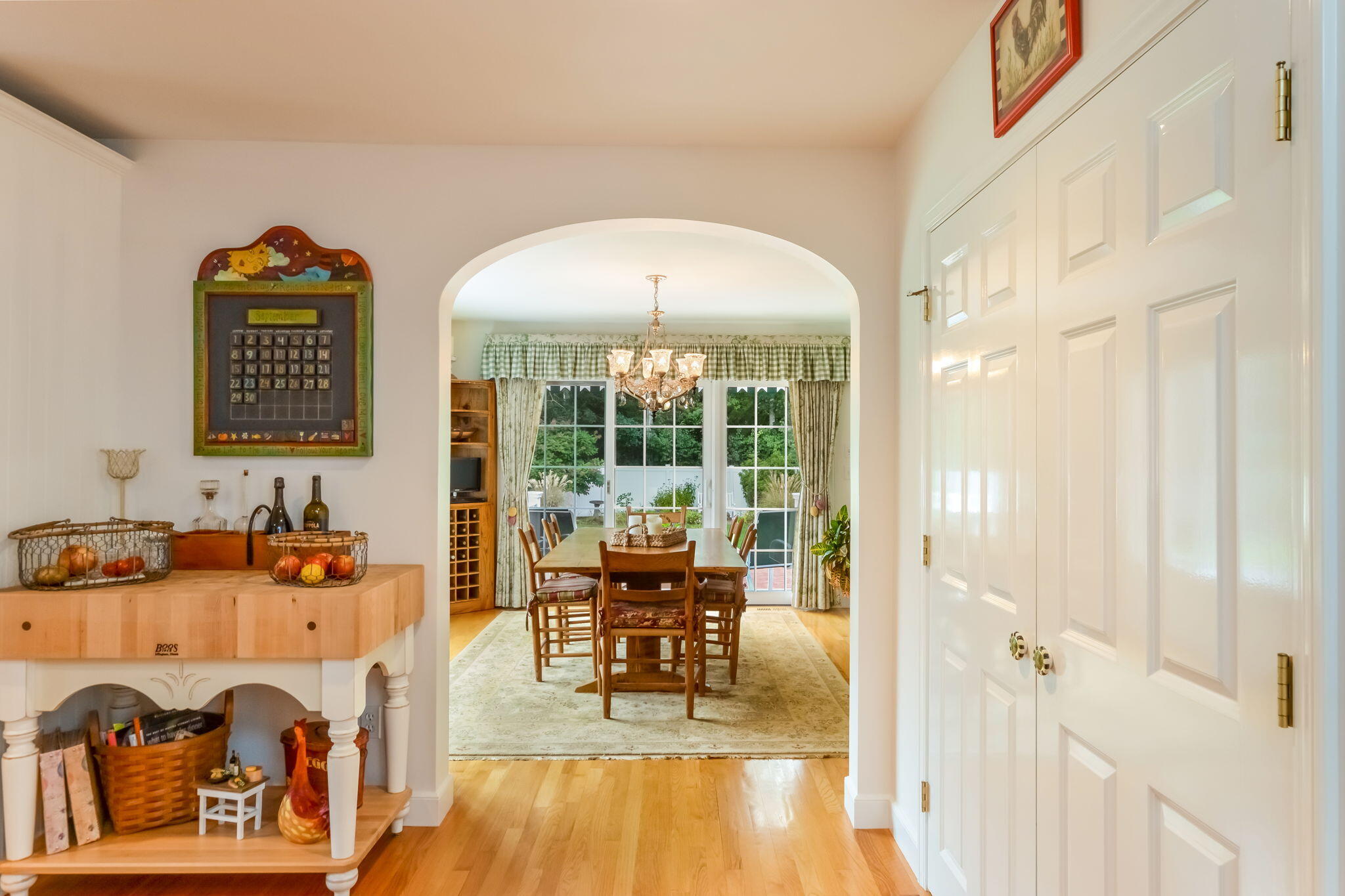 195 Cotuit Road, Unit 8 Marstons Mills, MA 02648 - Photo 10 of 46 a dining room with furniture and a floor to ceiling window