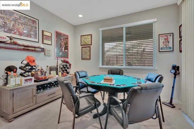 a utility room with cabinets washer and dryer