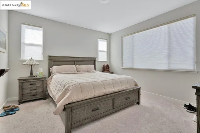 a view of a dining room with furniture and window