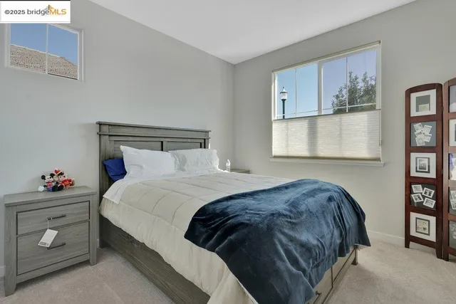 a en suite bathroom with a double vanity sink a mirror and a shower