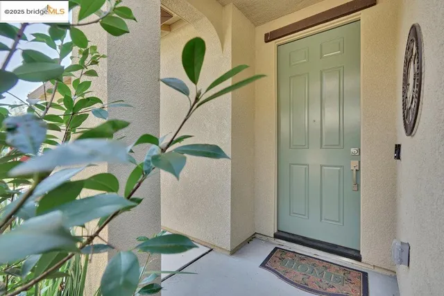 a view of a a dining room with furniture window and wooden floor