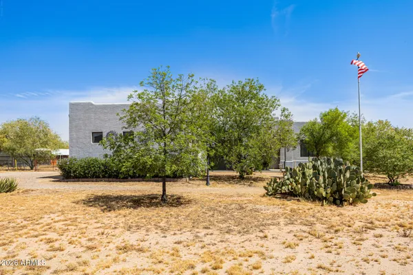 a backyard of a house with lots of green space
