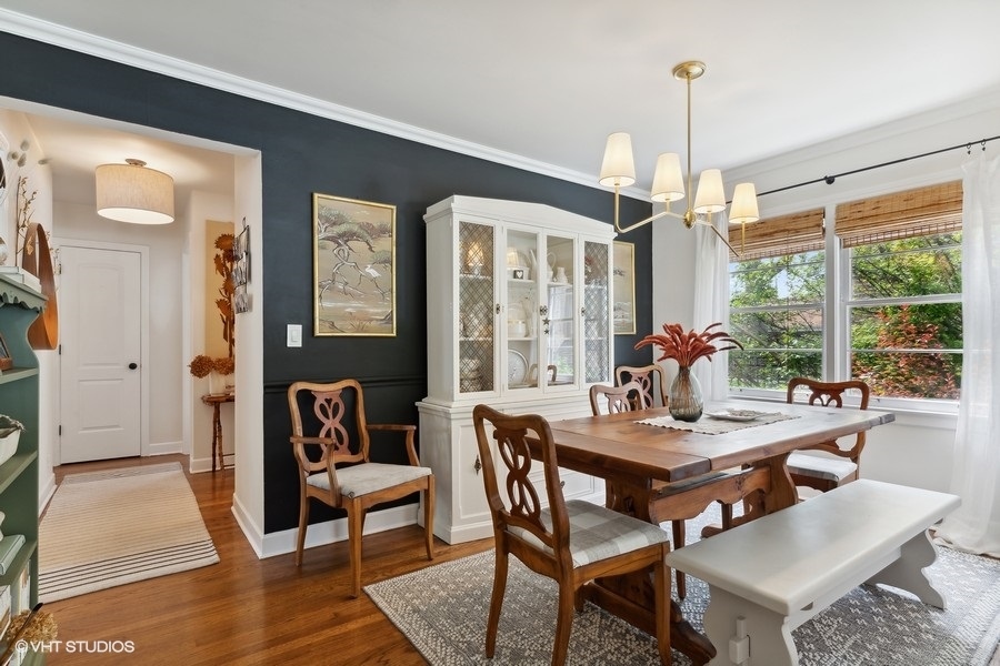 321 Stratford Road Des Plaines, IL 60016 - Photo 5 of 10 a dining room with furniture a chandelier and wooden floor