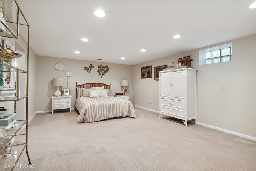321 Stratford Road Des Plaines, IL 60016 - Photo 8 of 10 a bedroom with a bed and a cabinets