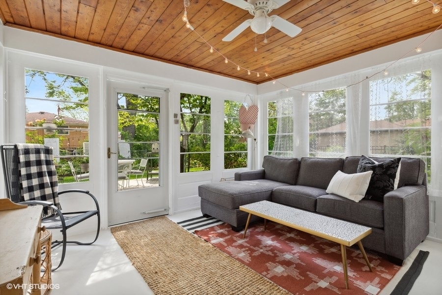 321 Stratford Road Des Plaines, IL 60016 - Photo 9 of 10 a living room with furniture and a floor to ceiling window