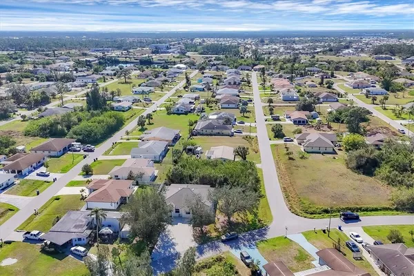 an aerial view of residential houses with outdoor space