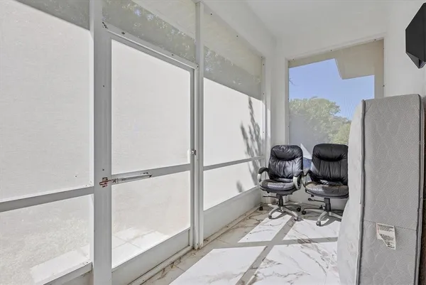 an aerial view of a house with a yard and lake view