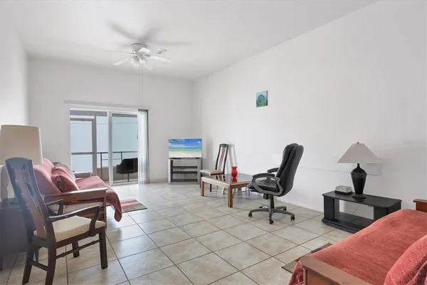 a living room with furniture gym equipment and a view of living room