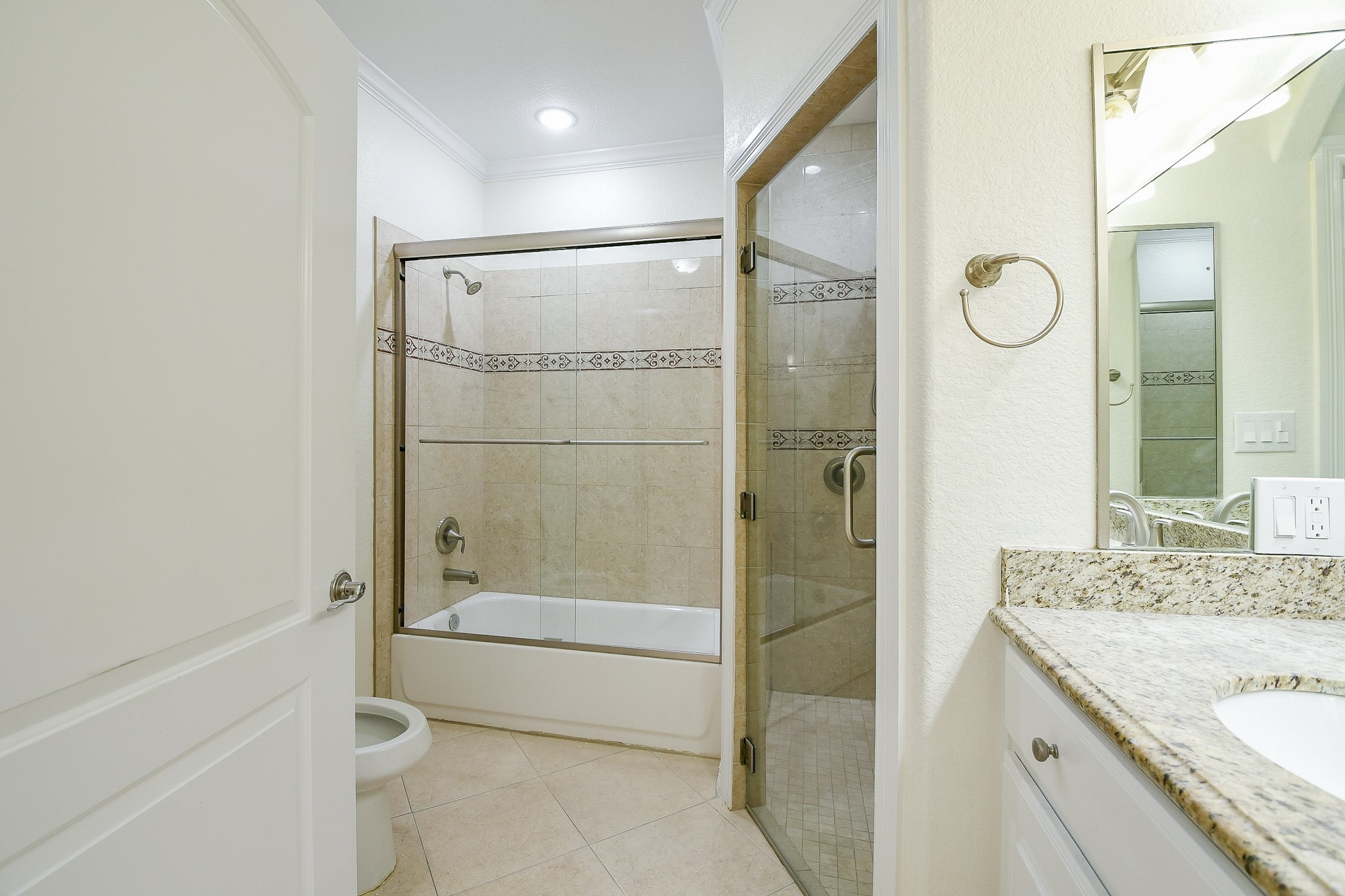 404 Moss Street Houston, TX 77009 - Photo 20 of 40 a bathroom with a granite countertop sink mirror toilet and bathtub