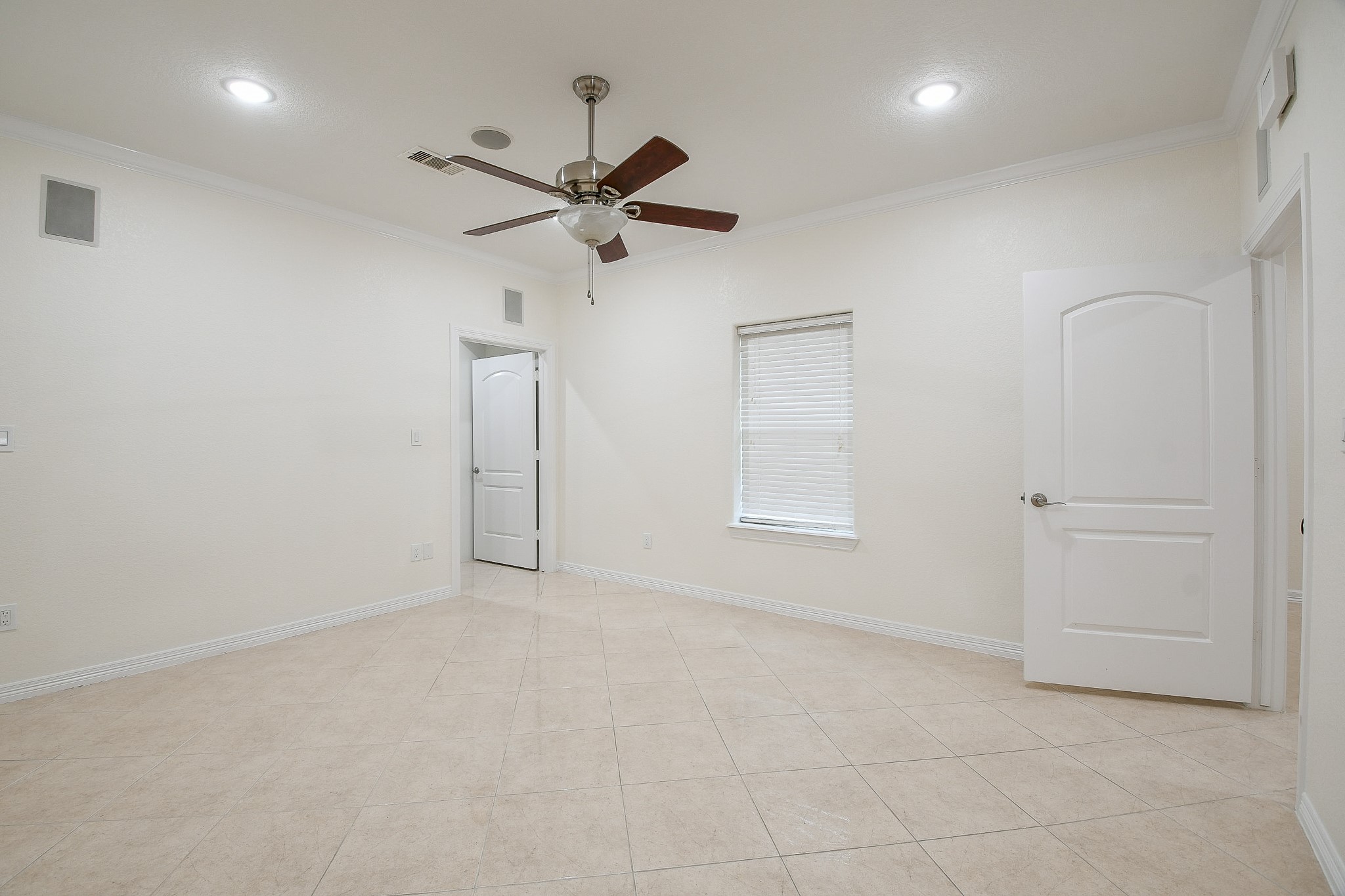 404 Moss Street Houston, TX 77009 - Photo 21 of 40 an empty room with a ceiling fan and a window