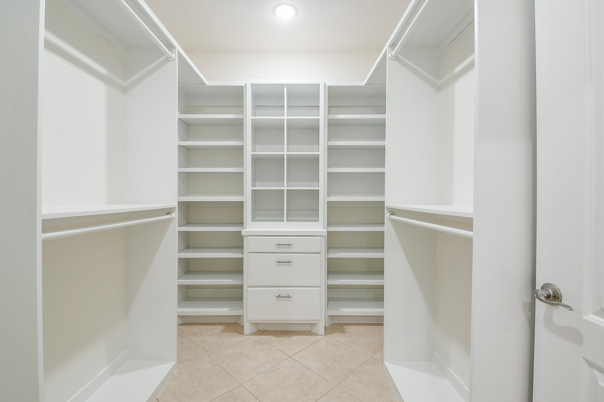 404 Moss Street Houston, TX 77009 - Photo 24 of 40 a view of walk in closet with empty racks