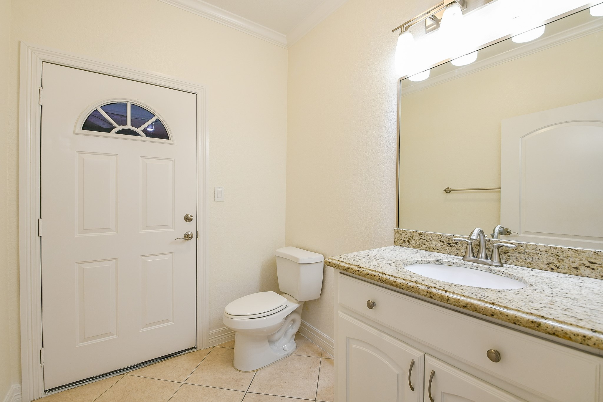 404 Moss Street Houston, TX 77009 - Photo 29 of 40 a bathroom with a granite countertop sink and a mirror