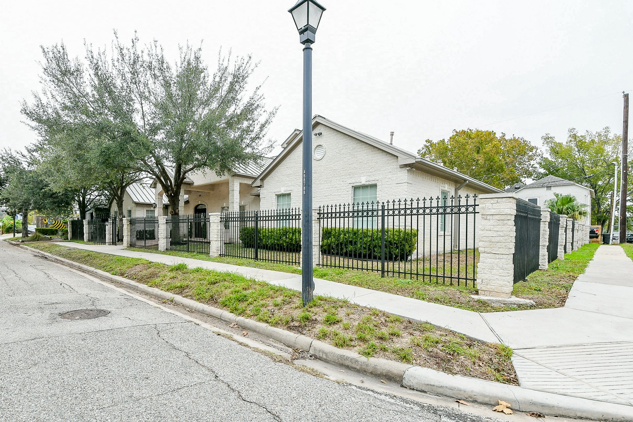 404 Moss Street Houston, TX 77009 - Photo 3 of 40 a view of a house with a big yard and potted plants