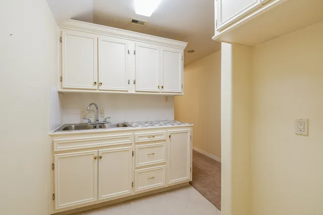 a view of cabinets and wooden closet