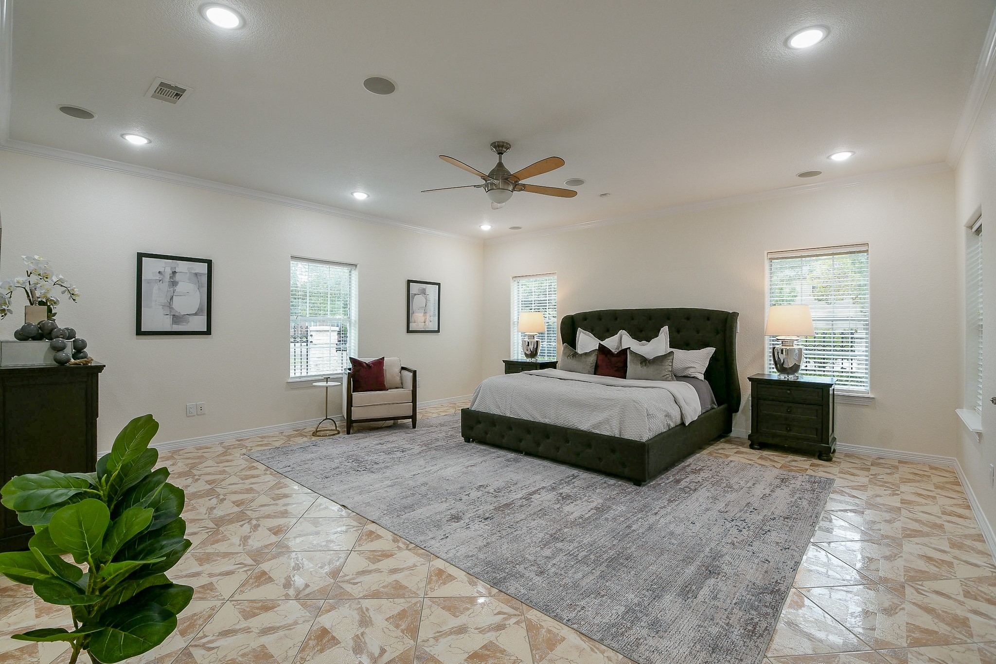 404 Moss Street Houston, TX 77009 - Photo 9 of 40 a bedroom with a bed and a chandelier