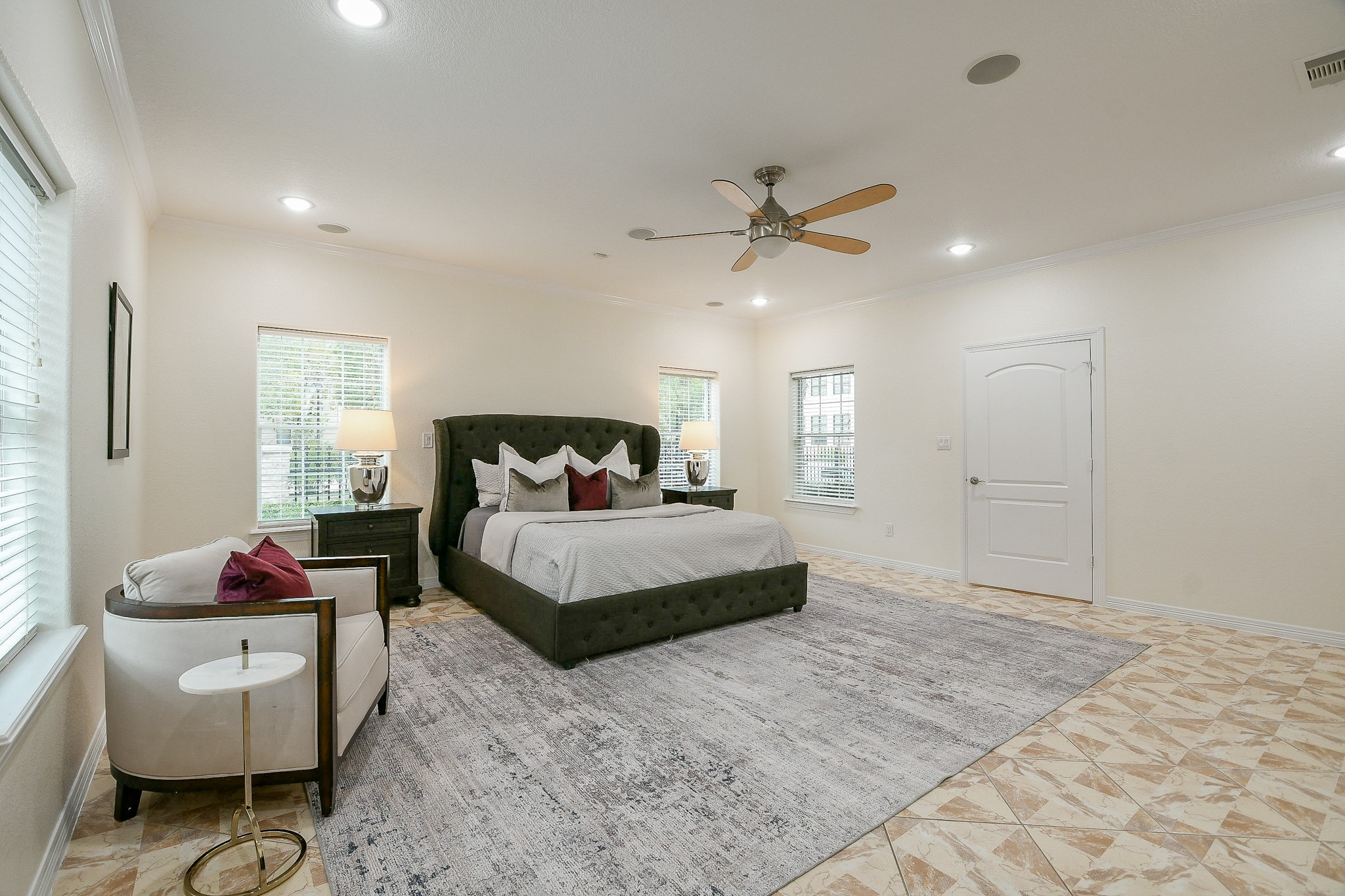 404 Moss Street Houston, TX 77009 - Photo 10 of 40 a bedroom with a bed and a chandelier