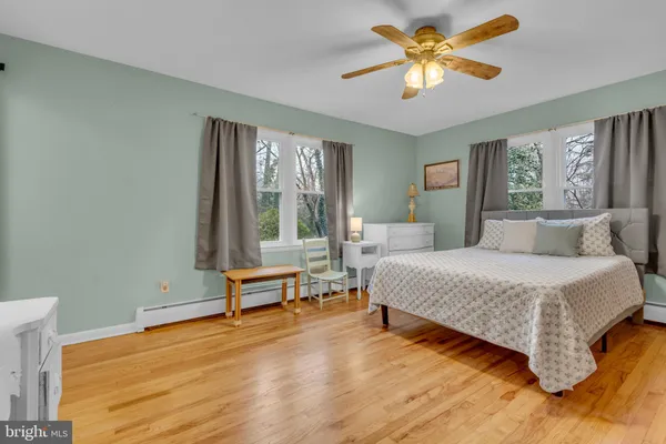 a view of room with window hardwood floor and ceiling fan