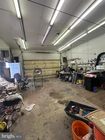 a room with lots of furniture and clutter