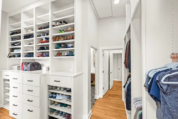 walk in closet with white walls