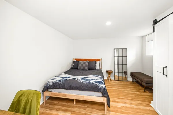 a bedroom with a bed and a view of bathroom